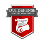 The image shows the logo of the DUI Defense Lawyers Association, featuring a red and gray shield with a scroll and quill pen.